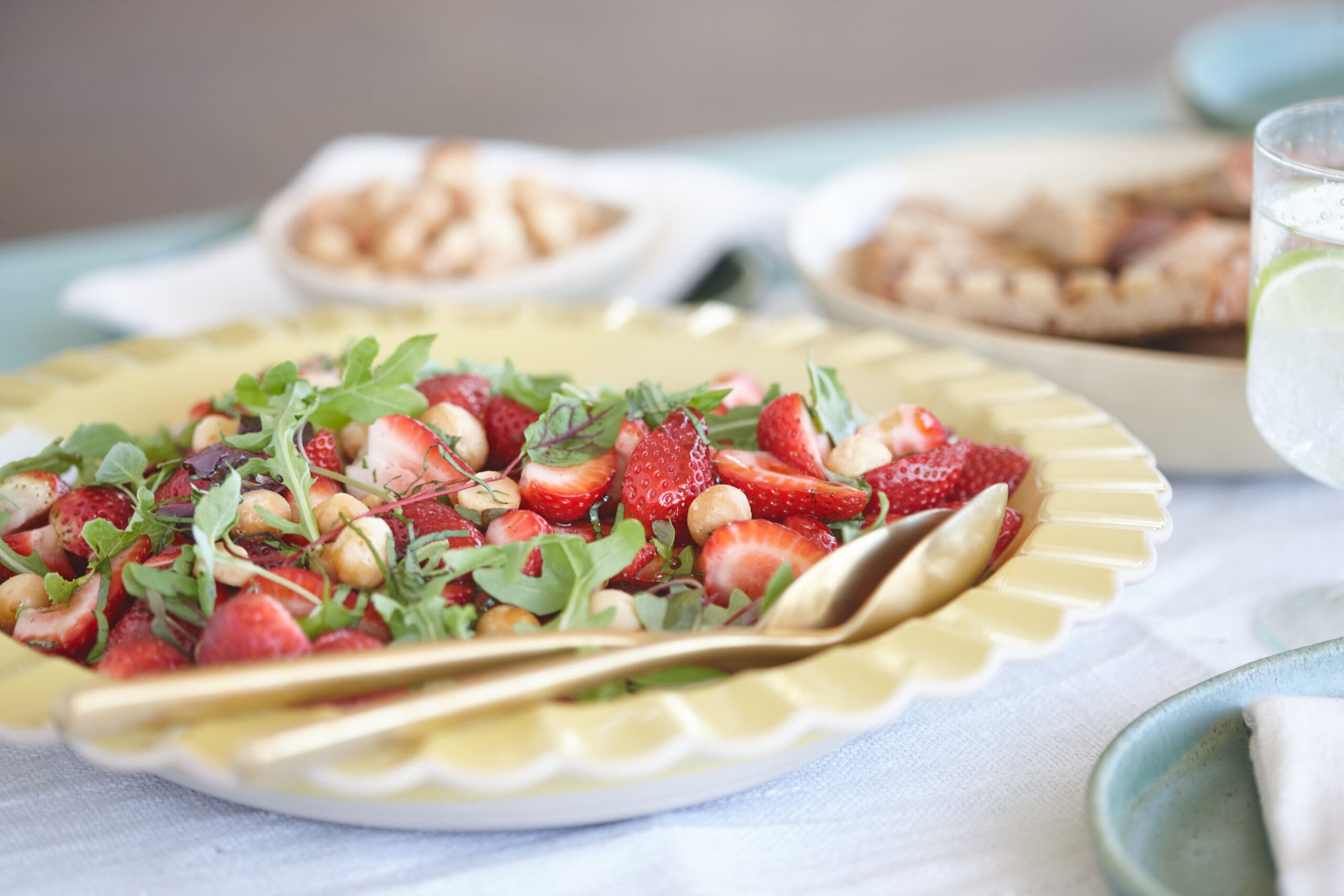 Strawberry salad with roasted macadamias and basil -